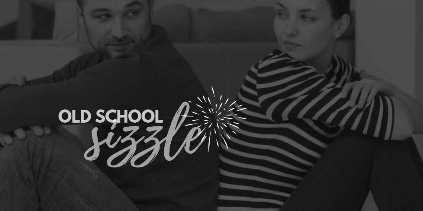 Old School Sizzle - two people sitting back to back with suggestive looks